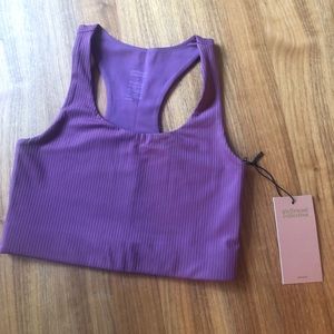 Girlfriend Collective “Paloma Racerback Bra” in Goji